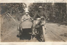 Ralph, about 19 years old here, drives her motorcycle with her friend in the side car.