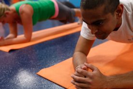 Ambar Sharma exercises in the on-site gym at Foot Levelers, where a personal trainer is also available.