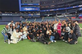 The Hash's gospel choir, Voices of Fire, celebrate their performance at the opening night of the 2025 World Series.