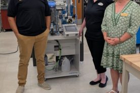 Dr. David Berry, program head of mechatronics at Virginia Western; Ginger Hultquist, business operations manager for Jewell Machinery in Rocky Mount; and Amy White, dean of STEM and workforce solutions at Virginia Western, pose in the campus mechatronics lab following the announcement of the College’s new status as an NC3 Leadership School.