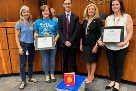 Jen Whitcomb (far right), children's Senior Library Assistant, was recently awarded Virginia Library Director's Staff Member of the Year award.