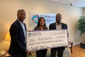 Pictured L-R: Damon Williams, President of Youth Sporting Incorporated, Ana Maria Barrios, Finance Associate of Community Foundation Serving Western Virginia, and Ramon Williams, Vice President of Youth Sports Incorporated.