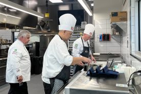 Team manager Chef Kevin Storm (left) inspects the work of Chef Troman Felizmenio (center) and Chef Ted Polfelt on Monday, Nov. 6.
