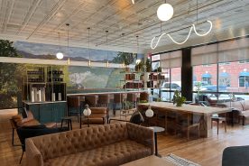 The main level of The Quarters features lots of natural light, comfortable seating and a coffee bar.