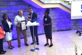 Roanoke Vice Mayor Joe Cobb presents Fetzer with a Proclamation of October as Bob Fetzer Month.