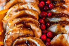 Pork simmered with orange and cranberries.