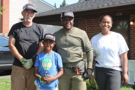 Sheriff Antonio Hash with community volunteers .