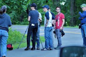 Writer/director Dean Kapsalis (center, in blue and white shirt) and producer Tommy Minnix (far right) brought the Epic Pictures project to Roanoke in 2017. Art director Jenna Giannini (far left) and the film crew were local hires.